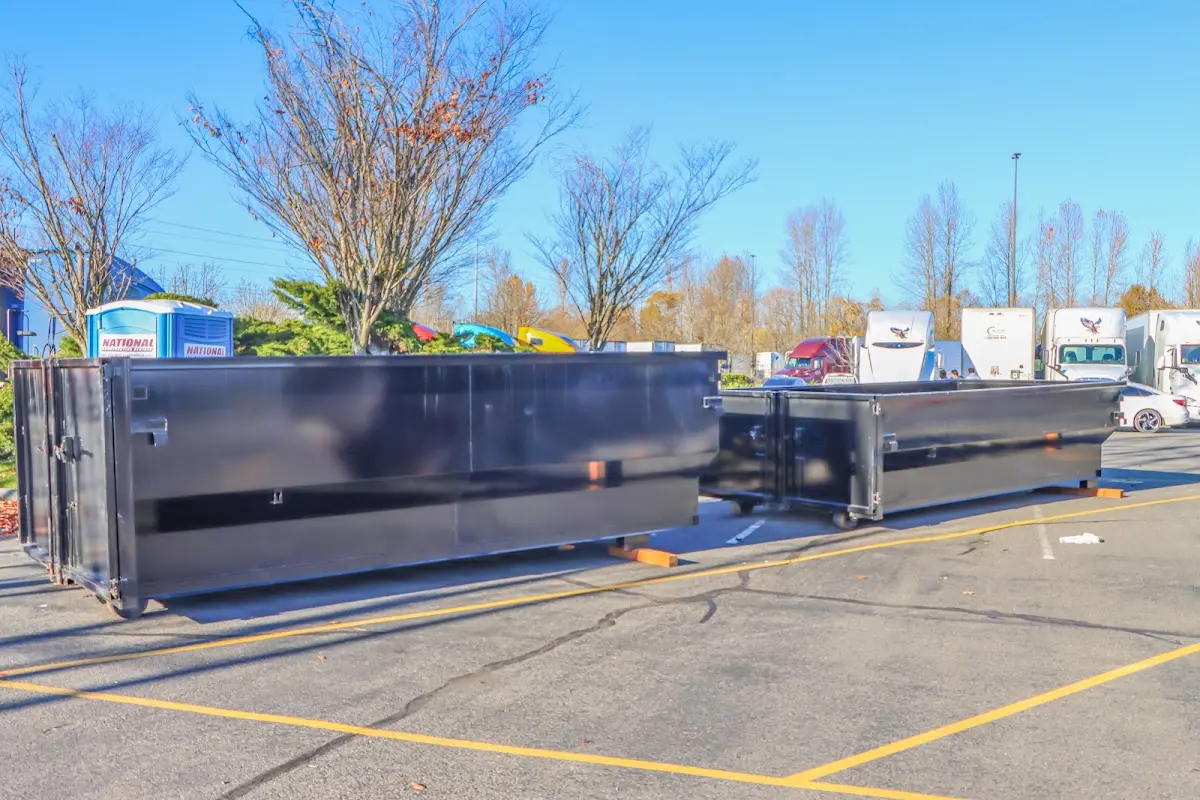 Professional dumpster rental service with roll-off container on residential driveway in Avon Lake